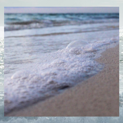 waves crashing on the sand at the beach