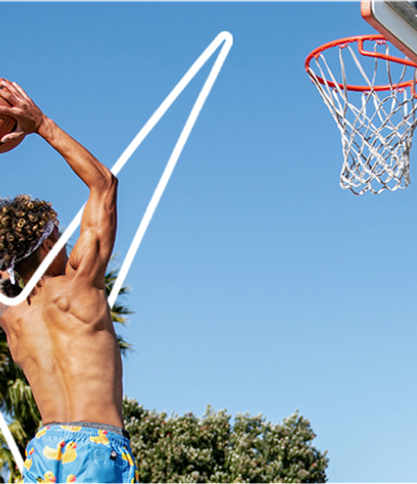 topless man about to sink a hoop